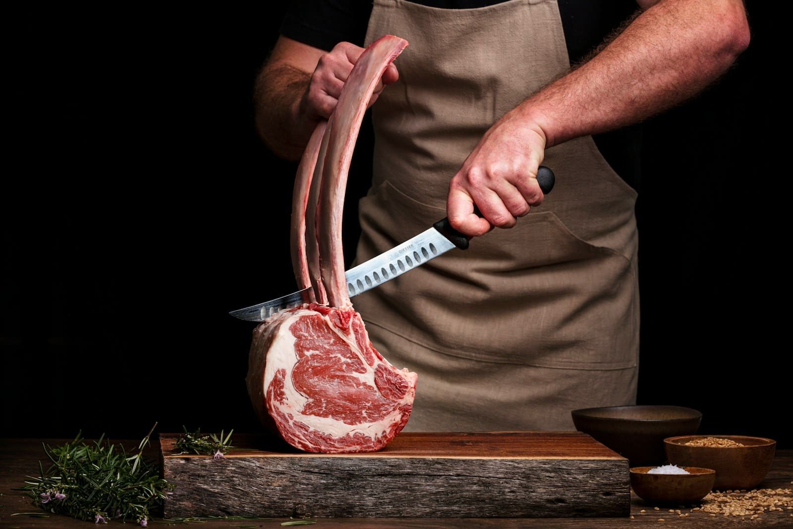 Meat being checked for quality during preparation