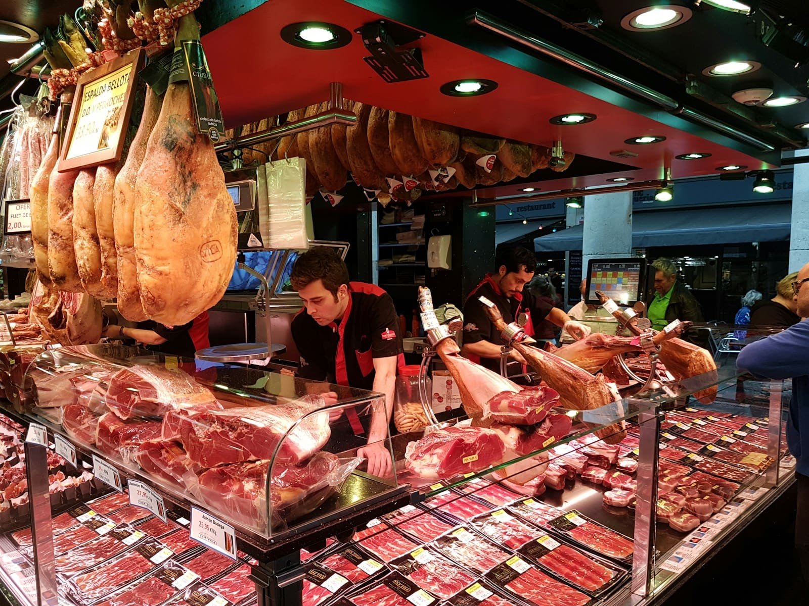 Customers being served at a fresh food counter